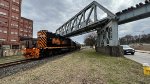 WE 7025 comes out from under the abandoned A&BB RR bridge.